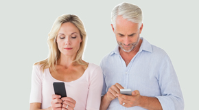 Vancouver couple using smartphones